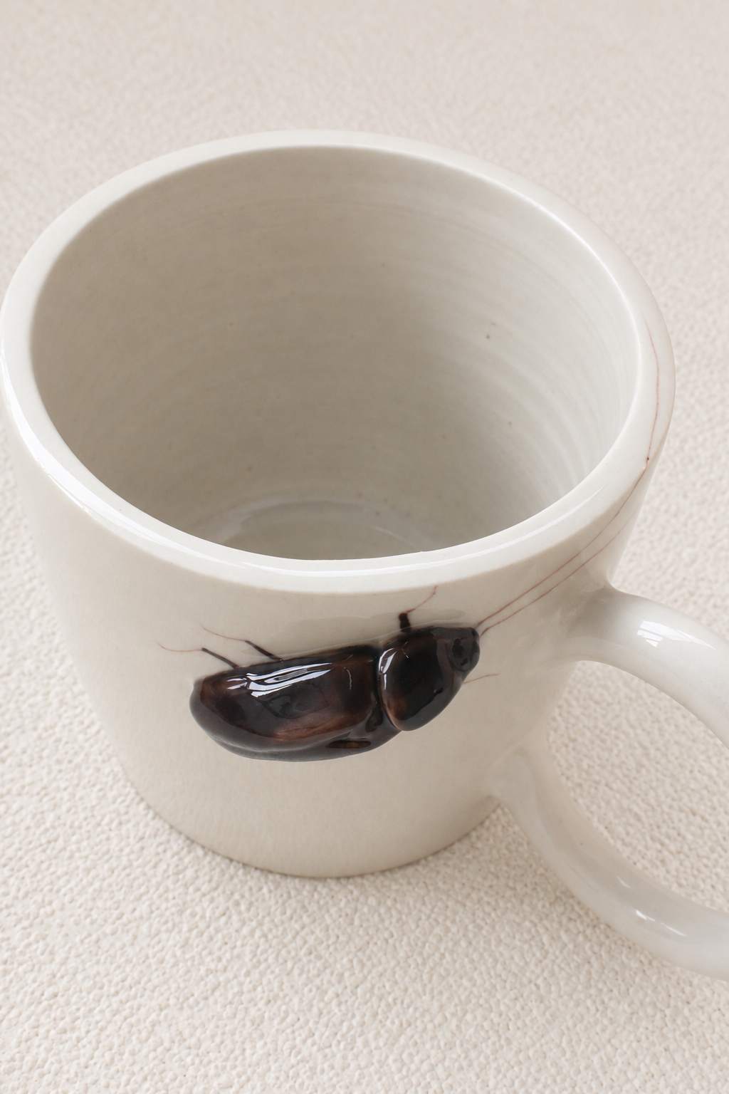 Handmade Ceramic Mug with a Raised 3D Cockroach