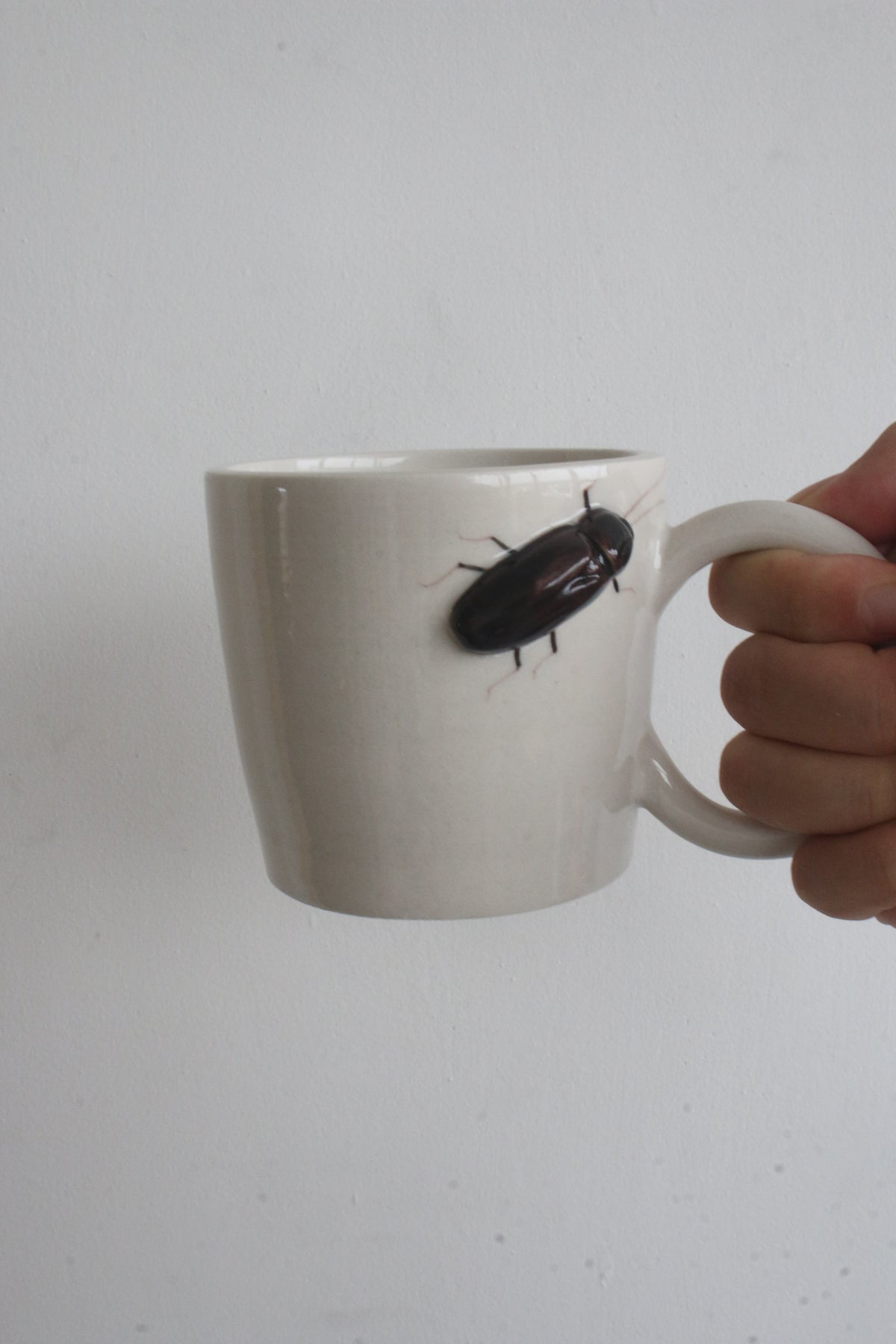 Handmade Ceramic Mug with a Raised 3D Cockroach